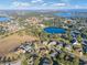 Aerial view of neighborhood near a lake at 11113 Scenic Vista Dr, Clermont, FL 34711
