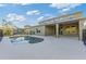 Inviting kidney-shaped pool with covered patio and fenced backyard at 11113 Scenic Vista Dr, Clermont, FL 34711