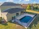 Elevated view of house and pool with fenced patio at 11113 Scenic Vista Dr, Clermont, FL 34711