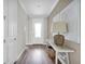 Light and bright entryway with wood-look floors and white walls at 13714 Fresh Ivy St, Winter Garden, FL 34787