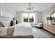 Spacious main bedroom with king-size bed and ample natural light at 13714 Fresh Ivy St, Winter Garden, FL 34787