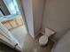 Powder room with toilet and view of another bathroom at 14515 Crestavista Ave, Clermont, FL 34714