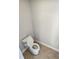 Small bathroom with toilet and tiled floor at 14521 Crestavista Ave, Clermont, FL 34714