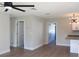 Bright living room with hardwood floors and ceiling fan at 1588 Clearfield St, Deltona, FL 32725