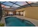 Covered patio and refreshing pool area at 16908 Florence View Dr, Montverde, FL 34756