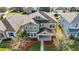 Aerial view of a charming two-story house with a landscaped yard at 1942 J Lawson Blvd, Orlando, FL 32824