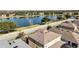 Aerial view of a house near a lake, offering serene waterfront views at 1942 J Lawson Blvd, Orlando, FL 32824