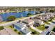 Aerial view of houses near a lake, showcasing tranquil waterfront living at 1942 J Lawson Blvd, Orlando, FL 32824