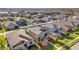 Aerial view of a residential neighborhood with houses and a lake at 1942 J Lawson Blvd, Orlando, FL 32824