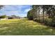 Spacious backyard with grassy area and a view of neighboring house at 1942 J Lawson Blvd, Orlando, FL 32824
