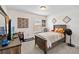 Cozy bedroom with a bed, desk, and charming wall decor at 1942 J Lawson Blvd, Orlando, FL 32824