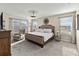 Main bedroom with king-size bed and relaxing sitting area at 1942 J Lawson Blvd, Orlando, FL 32824