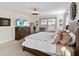 Bright bedroom featuring a comfortable bed and large windows at 1942 J Lawson Blvd, Orlando, FL 32824