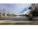 Peaceful canal view with homes and lush landscaping at 1942 J Lawson Blvd, Orlando, FL 32824