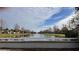 Serene canal view with fountain and neighborhood homes at 1942 J Lawson Blvd, Orlando, FL 32824