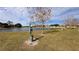 Community dog park with waste disposal station near a lake at 1942 J Lawson Blvd, Orlando, FL 32824