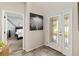 Bright entryway with a view of a bedroom and glass-paned door at 1942 J Lawson Blvd, Orlando, FL 32824