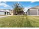Two-story house with a screened patio and driveway at 1942 J Lawson Blvd, Orlando, FL 32824