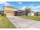 Two-story house with a screened patio and driveway at 1942 J Lawson Blvd, Orlando, FL 32824