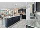 Island kitchen features granite countertops and dark wood cabinets at 1942 J Lawson Blvd, Orlando, FL 32824