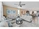 Open living room with two sofas and a view of kitchen and dining area at 1942 J Lawson Blvd, Orlando, FL 32824