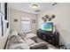 Living area features a comfortable sectional sofa and large TV at 1942 J Lawson Blvd, Orlando, FL 32824