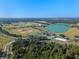 Aerial view of sprawling park with lake and sports fields at 2249 Palmetum Loop, Apopka, FL 32712