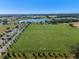 Aerial view of soccer field, park, and lake at 2249 Palmetum Loop, Apopka, FL 32712