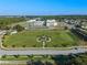Aerial view of community with school and playground at 2249 Palmetum Loop, Apopka, FL 32712