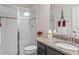 Clean bathroom featuring a walk-in shower, granite countertops, and a decorative Eiffel Tower figurine at 2249 Palmetum Loop, Apopka, FL 32712