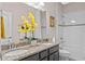 Bathroom with granite counters, double sinks and a tiled shower-tub combination at 2249 Palmetum Loop, Apopka, FL 32712