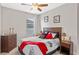 Comfortable bedroom with a dresser, nightstands, and a decorated bed with pillows at 2249 Palmetum Loop, Apopka, FL 32712