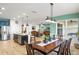 This is an interior view of the dining room with view into the kitchen and living room at 2249 Palmetum Loop, Apopka, FL 32712