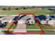 Charming single Gathering home featuring a well-manicured lawn and a brick-paved driveway at 2249 Palmetum Loop, Apopka, FL 32712