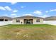 House with covered patio and large backyard at 2249 Palmetum Loop, Apopka, FL 32712