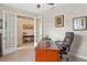 Office space with French doors, rich wood desk, and leather chair at 2249 Palmetum Loop, Apopka, FL 32712