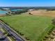 Expansive soccer field with well-manicured green grass, multiple goals, and bright stadium lighting at 2249 Palmetum Loop, Apopka, FL 32712