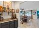 Wet bar with wine rack and shelving, adjacent to living room at 2249 Palmetum Loop, Apopka, FL 32712