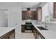 Modern kitchen with dark wood cabinets and a large island at 2322 Twin Flower Ln, Sanford, FL 32771