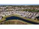This aerial view shows a neighborhood with serene water features and manicured lawns at 242 Aberdeen St, Davenport, FL 33896