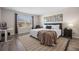 Main bedroom with a king-size bed, a workspace, and large window at 242 Aberdeen St, Davenport, FL 33896