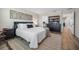 Well-lit bedroom with a queen-sized bed, accent rug, and ample storage, providing a serene and organized atmosphere at 242 Aberdeen St, Davenport, FL 33896
