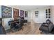 Entertainment room with a comfortable seating area, large computer, and gaming setup with interesting wall decor at 242 Aberdeen St, Davenport, FL 33896