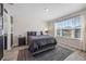 This bedroom features a large window for natural light and comfortable furnishings at 242 Aberdeen St, Davenport, FL 33896