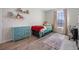 Small bedroom with twin bed and teal dresser at 242 Aberdeen St, Davenport, FL 33896