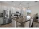 Modern kitchen with stainless steel appliances and a large kitchen island at 242 Aberdeen St, Davenport, FL 33896