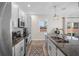 Well-appointed kitchen with modern appliances, granite countertops, and a functional layout at 242 Aberdeen St, Davenport, FL 33896