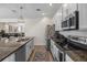 Stylish kitchen with modern appliances, granite countertops, and an open layout at 242 Aberdeen St, Davenport, FL 33896