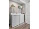 A convenient laundry room offers efficiency with modern appliances and ample space at 242 Aberdeen St, Davenport, FL 33896