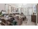 Spacious living room with modern decor, large sectional sofa, and ample natural light at 242 Aberdeen St, Davenport, FL 33896